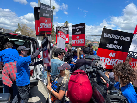 WGA Staff and members unloading picket signs at Netflix