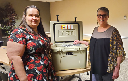 Yeti cooler winner Kate Vassar (right) with PEF Region 7 Coordinator Barbara Stranksy