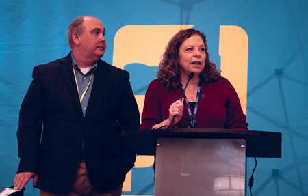 Assistant Director of OER Ed Cottrell and PEF Health & Safety Director Geraldine Stella address the conference on Dec. 13.