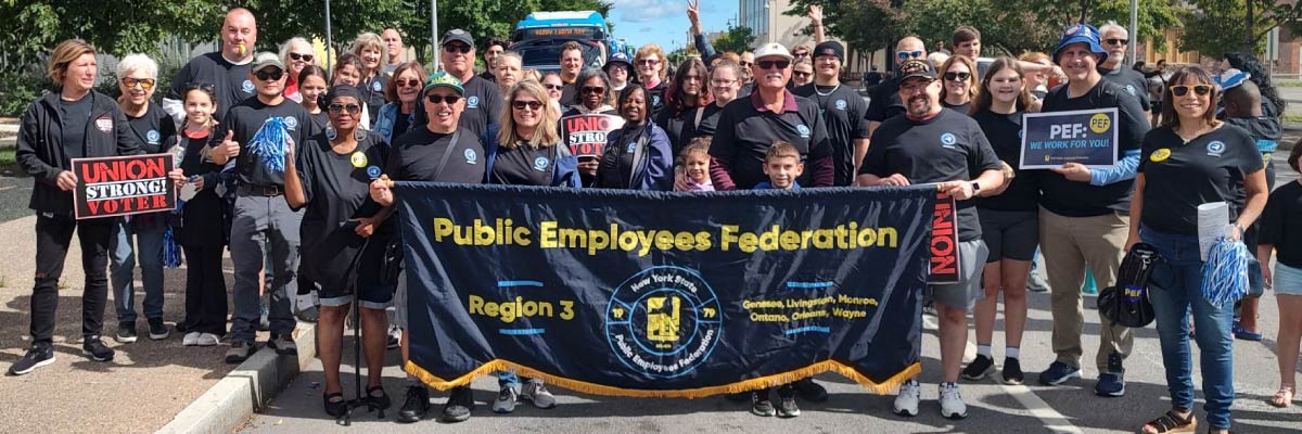  PEF Region 3 members march through the streets of Rochester on Labor Day.