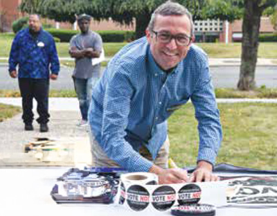 PEF leaders andmembers gather Saturday, September 30 at the Cornerstone Church in Freeport to help recent hurricane victims. PEF Division 241 council leader Joe Adipietro writes a check while others donated clothes and supplies. The Suffolk County Association of Municipal Employees donated boxes of T-shirts. PEF President Wayne Spence, state Sen. John Brooks and Assemblywoman Michaelle Solages helped. 